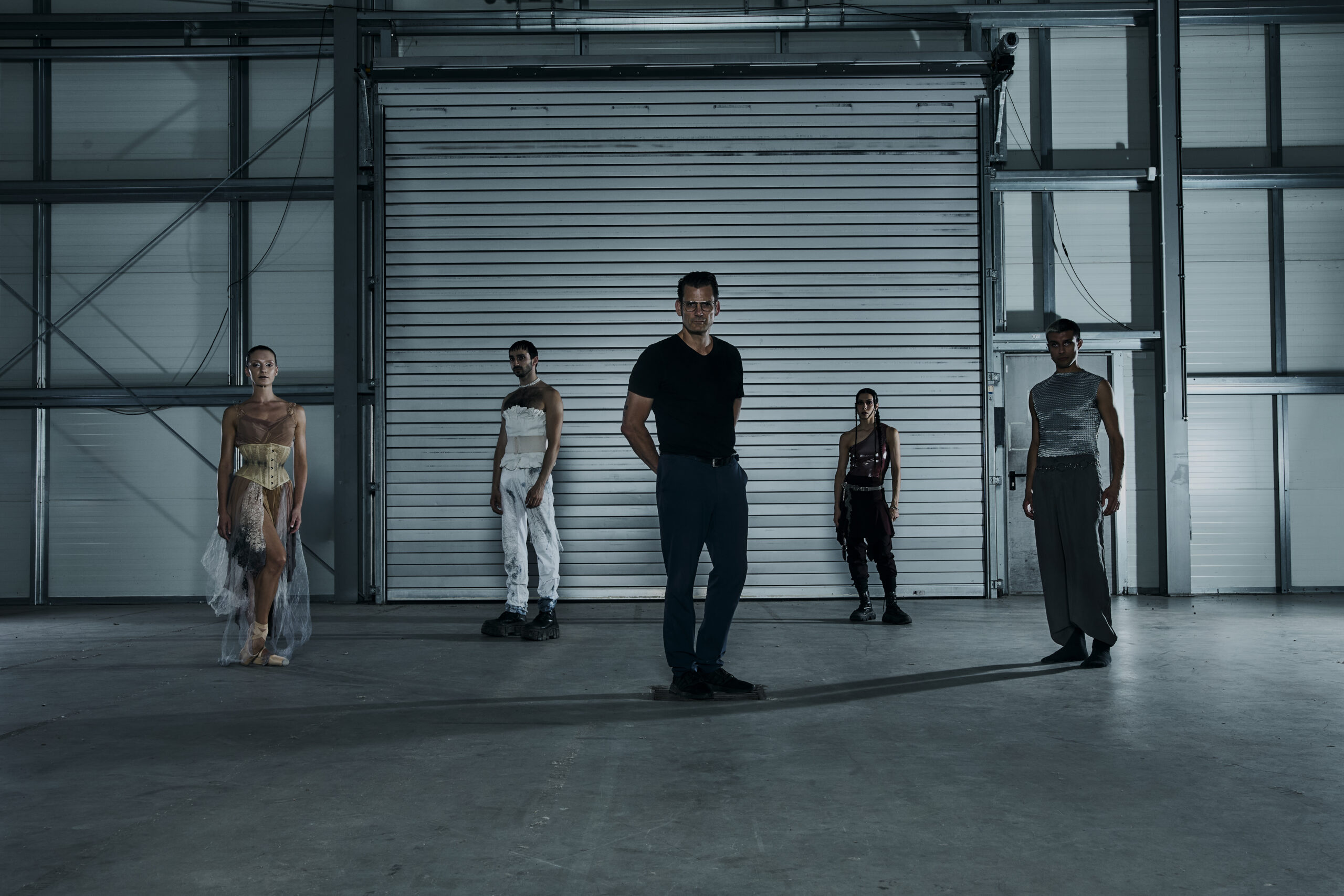 Norman Nodge (centre) and Metaxy cast in avant-garde costumes posing in House 12 at Atelier Gardens, Berlin